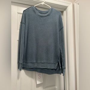 Size small muted teal colored sweatshirt